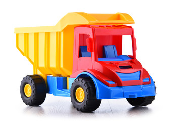 Fototapeta premium Colorful plastic truck toy isolated on white