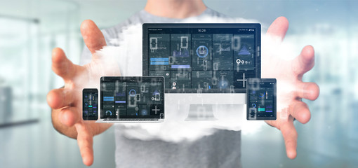 Businessman holding Devices connected to a cloud multimedia network 3d rendering