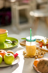 Fresh orange juice in the glass with a straw. close up photo. health and body care