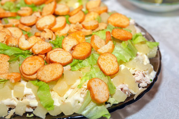 Chicken salad with pineapples and crackers on the table. Festive dish.