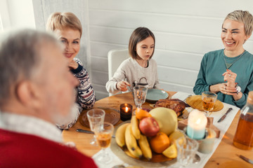 Smiling friendly people sitting at dining table. close up shot. happiness, friendship, holiday