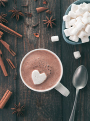 Hot chocolate with marsmallow in heart shape. St. Valentine Day concept. Copy space. Top view or flat-lay.