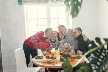 friendly happy people are hugging each other. love , friendship concepts. ideal family embracing each other. united large family