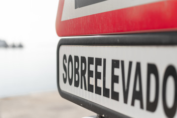 Road Warning Sign with text in Spanish