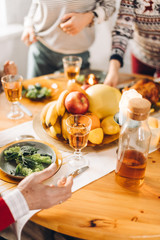 people standing near the table with food. close up cropped photo