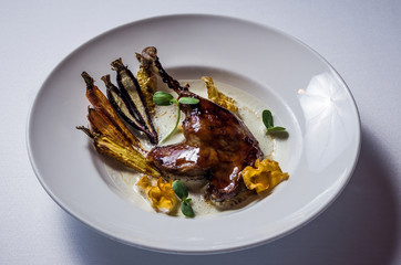 Duck leg glazed with maple syrup