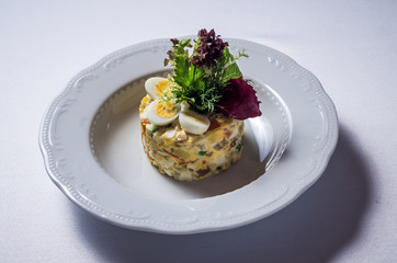 Salad Olivier with beef tongue