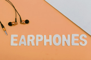 Top view of Earphones on texture background. Pastel color concept, Minimal concept. Copy space....