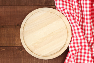 Cutting board or chopping board on wooden table.