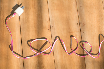 Cable connector USB-B or USB-C on wooden background, Connector with wire, Concept of connection,...