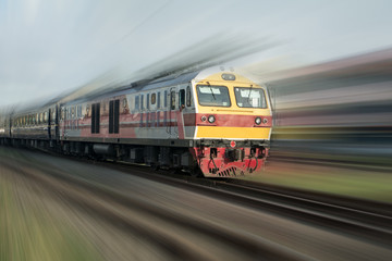 Old train in motion at the railway , Fast train passenger locomotive in motion at the railway station city