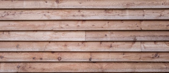 Obraz premium Raw larch wooden facades, Wooden wall background, Spruce wood house facade 