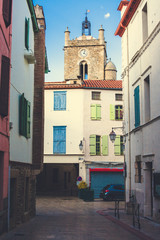View to bell tower and ancient medieval houses of Vinca, a French village in Estern Pyrenees