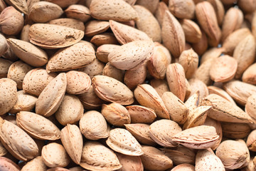 Shelled almonds as a background at market. Stock photo.