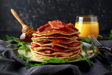 Pancakes with crispy bacon and maple syrup in a plate. Morning Breakfast