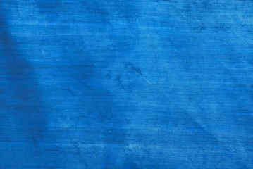 blue fabric texture from a piece of dirty tarpaulin