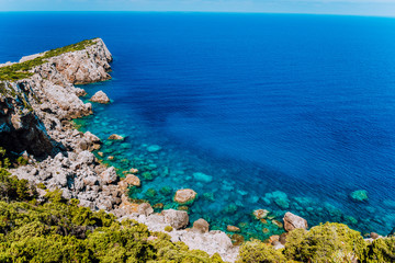 Rocky cliffs at mediterranean sea coast. Beautiful sea view coastline, vast seas