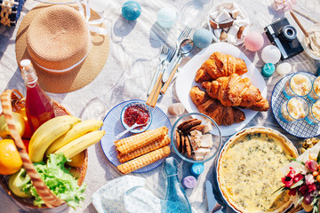 Tasty food and accessories outdoor summer or spring picnic. Lunch in the beach.