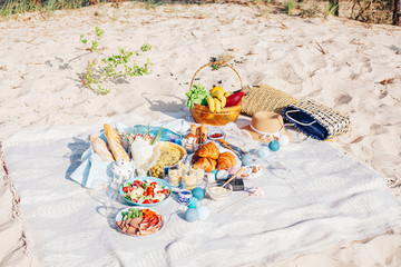 Tasty food and accessories outdoor summer or spring picnic. Lunch in the beach.