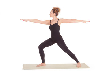 Beautiful Yoga: Senior Woman doing Virabhadrasana Warrior one pose