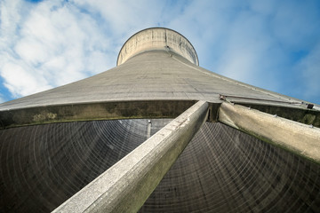 Looking up at a concrete cooling tower background