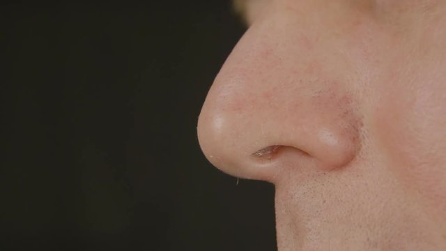 Men's nose, profile close-up. Smell concept