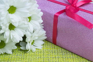 Gift and flowers for the day of March 8 close-up.