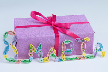 Gift for the day of March 8 on a white background.