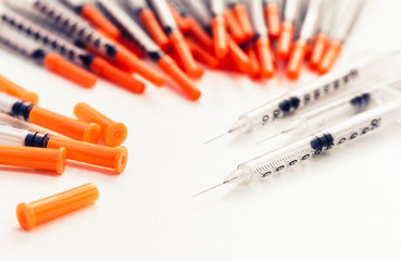 Pile of medical syringes for insulin for diabetes .