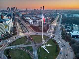 WARSAW, POLAND - NOVEMBER 17, 2018: Beautiful panoramic aerial drone view to "Babka" roundabout with a large national Polish flag on a high mast located in Warsaw, Poland, from drone