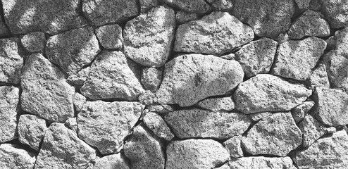 Big gray stone wall and pattern of shadow for background in black and white style - Art wallpaper, Decorated and Exterior design concept 