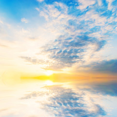Background sky during sunset and water reflections.
