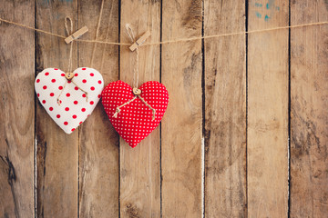 Heart  hanging on wood background with copy space.