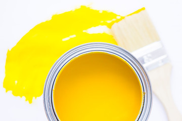 House renovation concept, colorfull paint cans and paintbrushes on wooden background