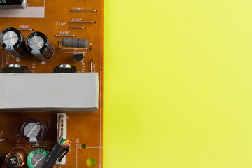 power supply board on yellow background with copyspace. detail electronic circuit board