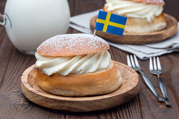 Traditional swedish dessert Semla, also called Shrove bun, with almond paste and whipped cream...