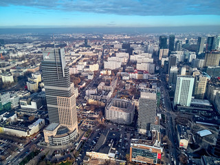 Fototapeta na wymiar WARSAW, POLAND - NOVEMBER 27, 2018: Beautiful panoramic aerial drone view to the center of Warsaw City and The Warsaw Trade Tower (WTT) - skyscraper along with the Palace of Culture and Science