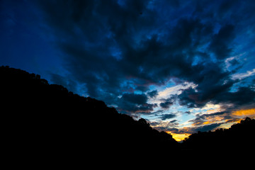 Sunset mountain peaks sky panorama. Mountain peaks sunset view