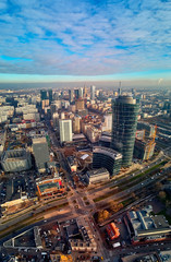 Fototapeta na wymiar WARSAW, POLAND - NOVEMBER 27, 2018: Beautiful panoramic aerial drone view to the center of Warsaw City and The Warsaw Spire - 220 metre neomodern office building on European square (Plac Europejski)