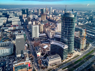 WARSAW, POLAND - NOVEMBER 27, 2018: Beautiful panoramic aerial drone view to the center of Warsaw City and The Warsaw Spire - 220 metre neomodern office building on European square (Plac Europejski)