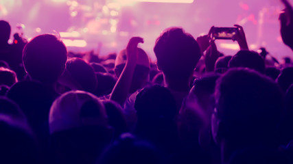 abstract colorful background audience in public concert.