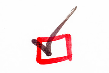 Close-up red checkbox with black tick mark white background