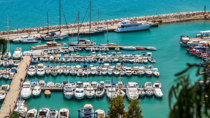 HAMMAMET, TUNISIA - AUGUST 19, 2010: Moored Yachts Pier Yasmine Hammamet