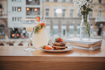 Cute girl eating pancakes