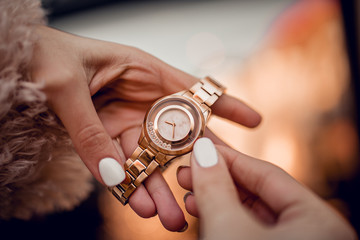 Very beautiful golden watch on woman hand