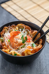 Thai omelette with noodles and shrimps, copy space