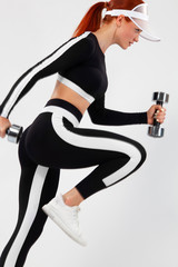 Fototapeta na wymiar Sporty fit woman, athlete with dumbbells makes fitness exercising on white background.