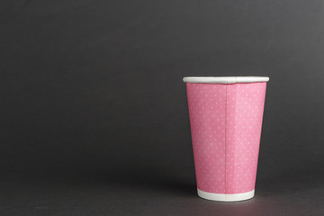 paper cup on black background