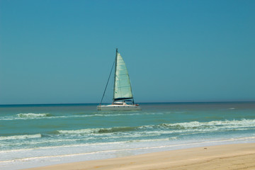 Obraz premium Sailing boat in the Mediterranean sea. 20 km long sandy beach of Patara. Turkey
