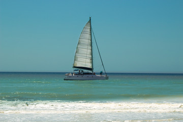 Fototapeta premium Sailing boat in the Mediterranean sea. 20 km long sandy beach of Patara. Turkey